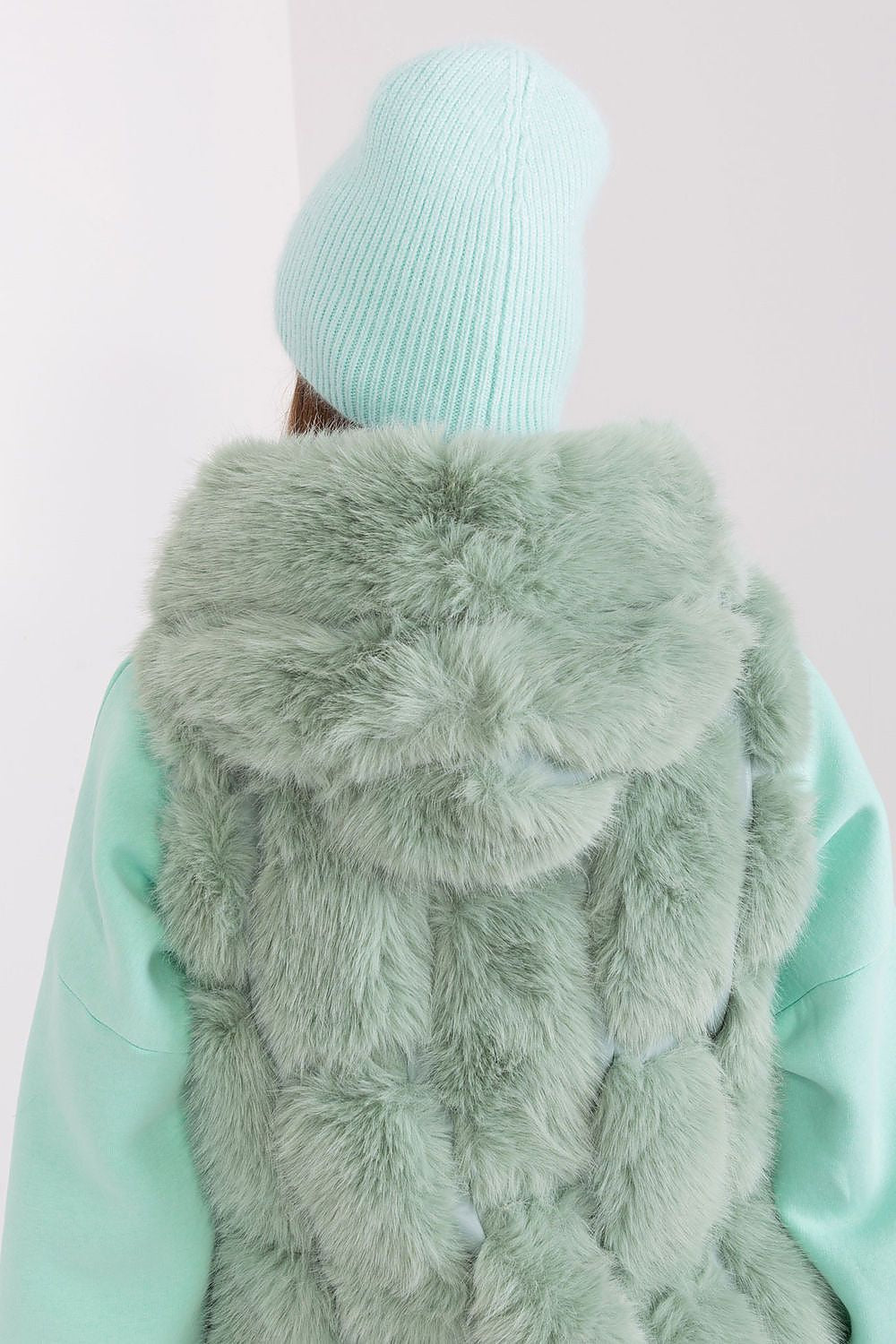 Luxury winter hat from AT showcasing a beautiful braided texture and distinctive front embellishment, designed with 60% acrylic and 40% angora.