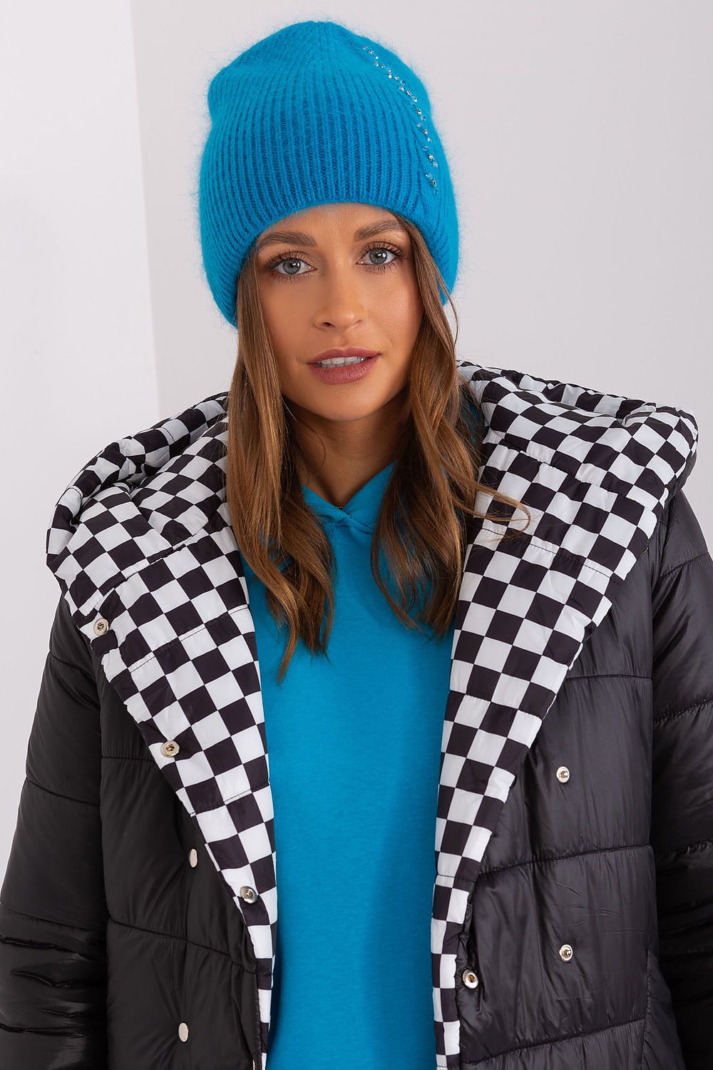 Chic winter warm hat showcasing a refined braided texture and special front feature, created by AT from a blend of 60% Acrylic and 40% Angora.