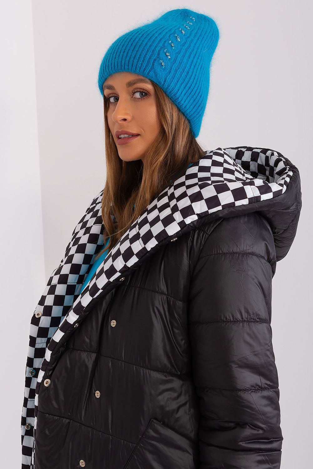 Luxury winter hat with elegant braided styling and exclusive front application, produced by AT using 60% Acrylic and 40% Angora.