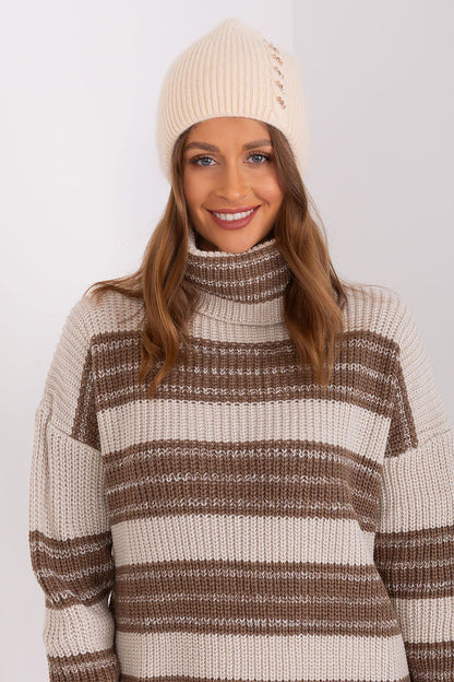 Stylish winter hat featuring a unique front application, made by AT, perfect for luxury cold-weather fashion.