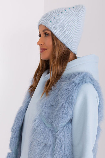 Close-up of the luxurious texture of the winter warm hat by AT, showcasing the intricate braided pattern and unique front detail, ideal for chic winter fashion.