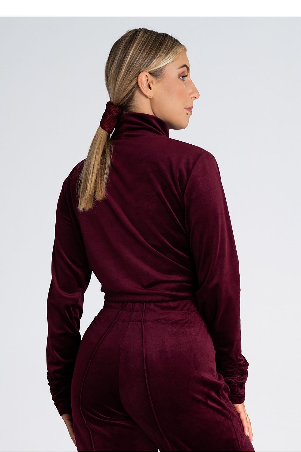 Close-up of Figl's women's luxury velour turtleneck sweatshirt, highlighting the rich fabric and sophisticated finish.