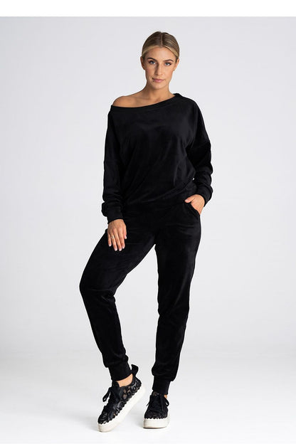 Elegant Figl velour trousers showcasing a soft, luxurious texture with elastic cuffs and convenient pockets.