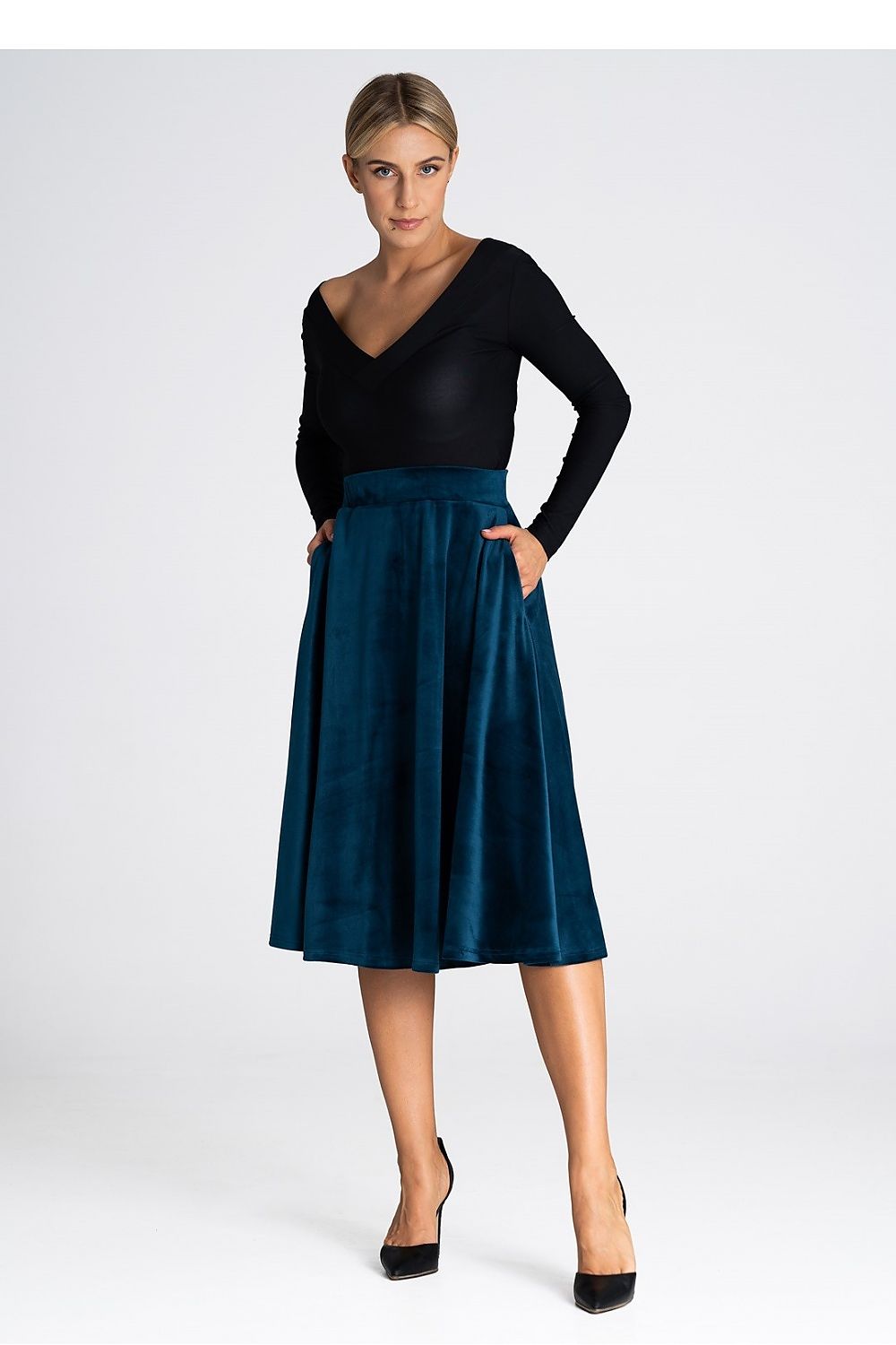 Stylishly worn Figl midi skirt, demonstrating its flattering fit and elegant flared design, perfect for formal occasions.