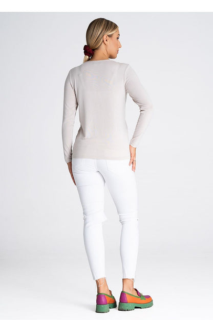 Model wearing a luxury Figl blouse with long sleeves and V-neck, demonstrating its stylish appeal and comfortable fit for sophisticated outfits.