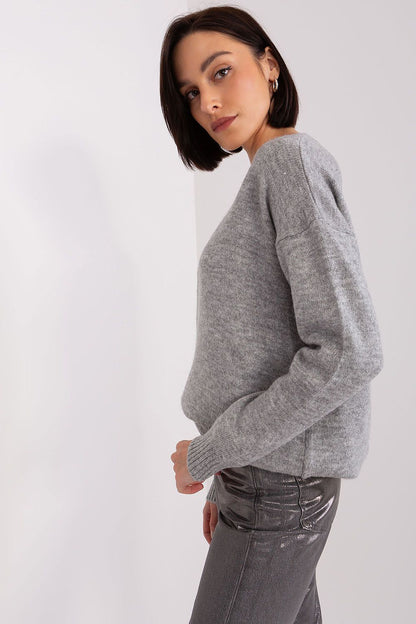 Model wearing the versatile long sleeve heart neckline jumper by Rue Paris, styled with jeans for a chic everyday look.