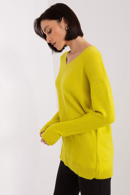 Stylish Rue Paris Women's Acrylic Long Sleeve Sweater showcased in a warm setting, highlighting its soft fabric and heart neckline.