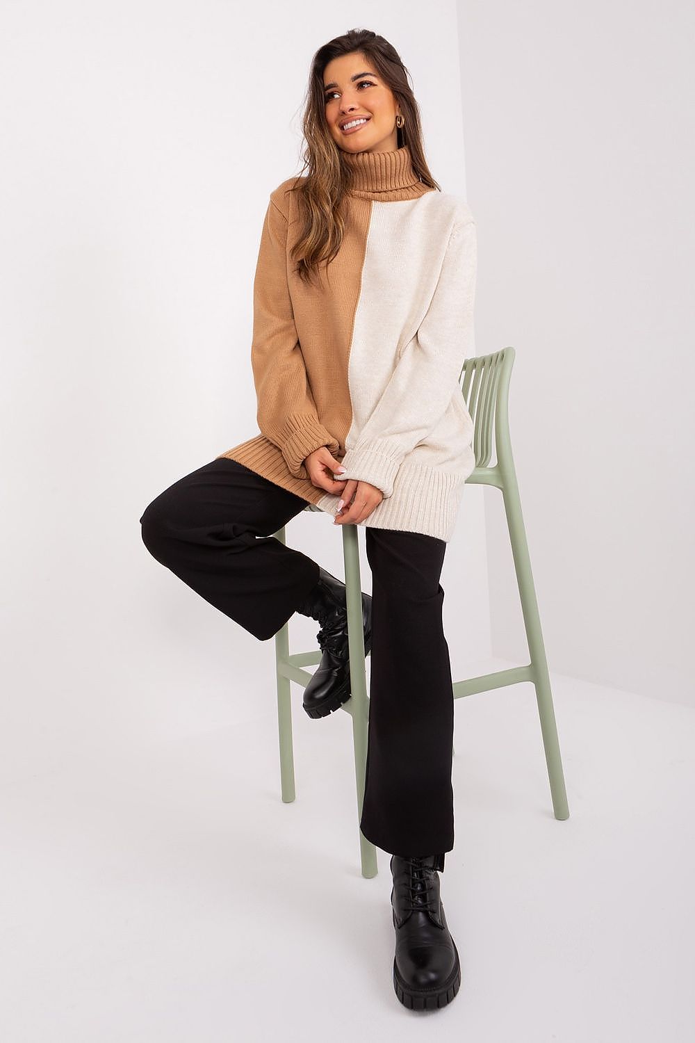 Badu two-tone turtleneck sweater on a flat lay, emphasising its contemporary design and premium acrylic fabric, ideal for comfort and sophistication.