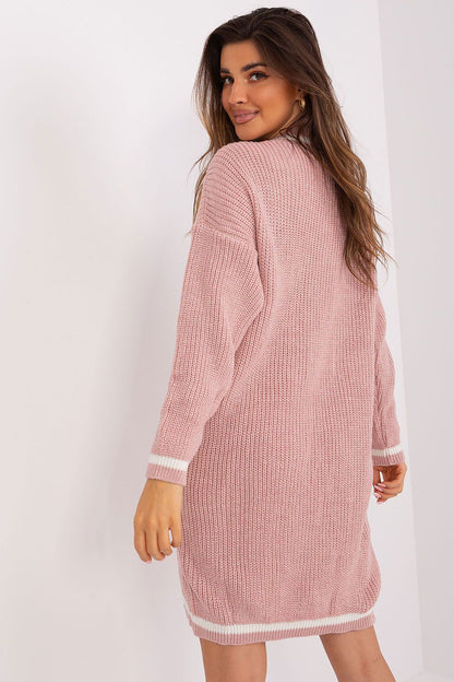 Badu's stunning oversized knit dress, with long sleeves and a flattering heart neckline, embodies casual elegance and warmth for women's fashion.