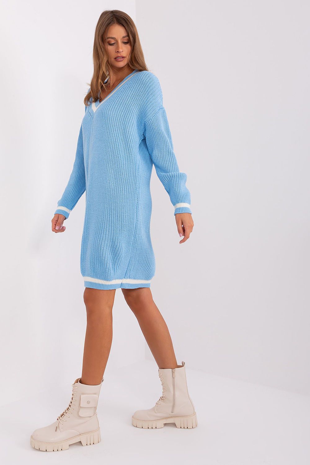 Elegant long-sleeve oversized knit dress by Badu, showcasing its versatile design and knee-length cut, perfect for chic everyday wear.