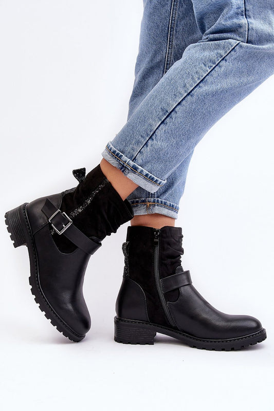 Close-up view of Step in Style's women's eco leather ankle boots, showcasing the chic sequined embellishments and luxurious faux fur lining.