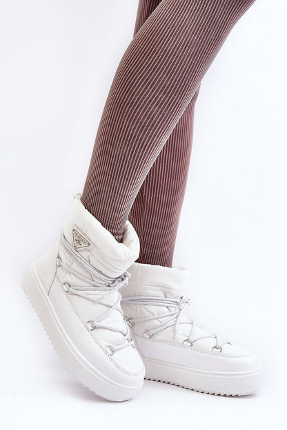 Luxury women's snow boots by Step in Style with insulated fur lining, ankle height design, and thick platform for ultimate comfort in cold weather.