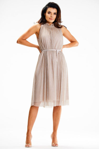 Flattering fit of Awama's midi dress on a model, highlighting its elegant silhouette and design details.