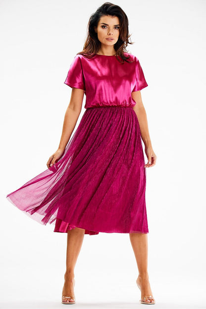 Stylish model wearing the Elegant Midi Evening Dress by Awama, highlighting its flattering silhouette and sophisticated design.