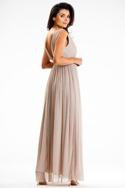 Elegant Awama Maxi Dress featuring a flared bottom and front slit, crafted from shiny mesh with satin lining, perfect for evening outings.