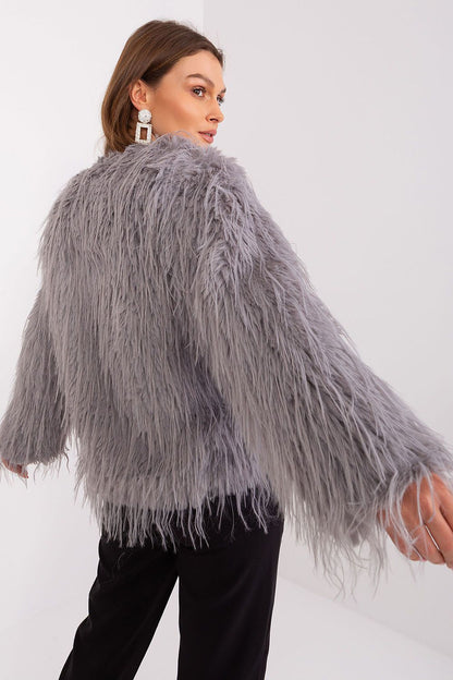 Sophisticated autumn-winter transitional jacket by AT featuring luxurious fur trim for an elegant look.