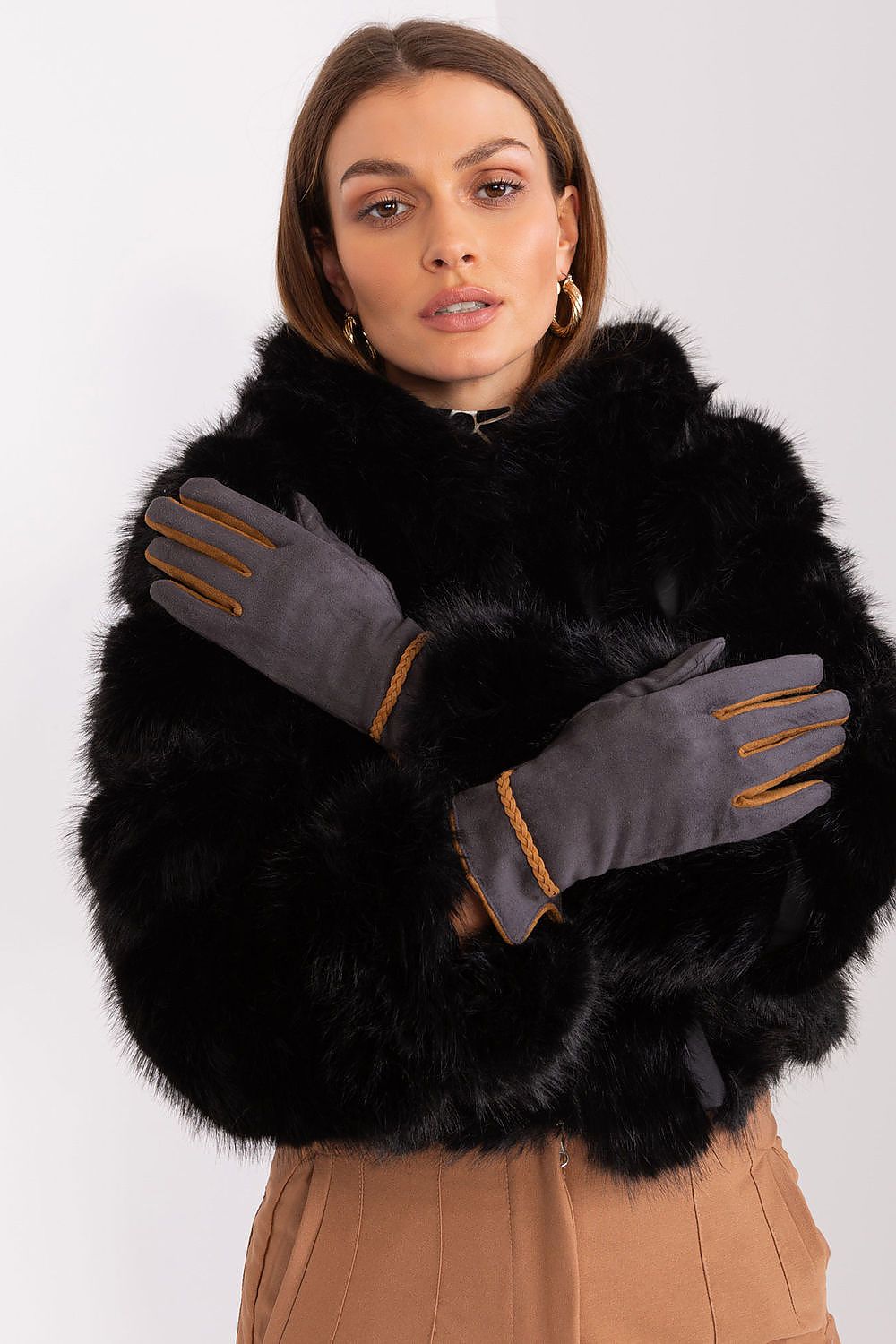 Chic women's gloves by AT featuring a fashionable design with contrast elements and practicality for smartphone use, enhancing any outfit.