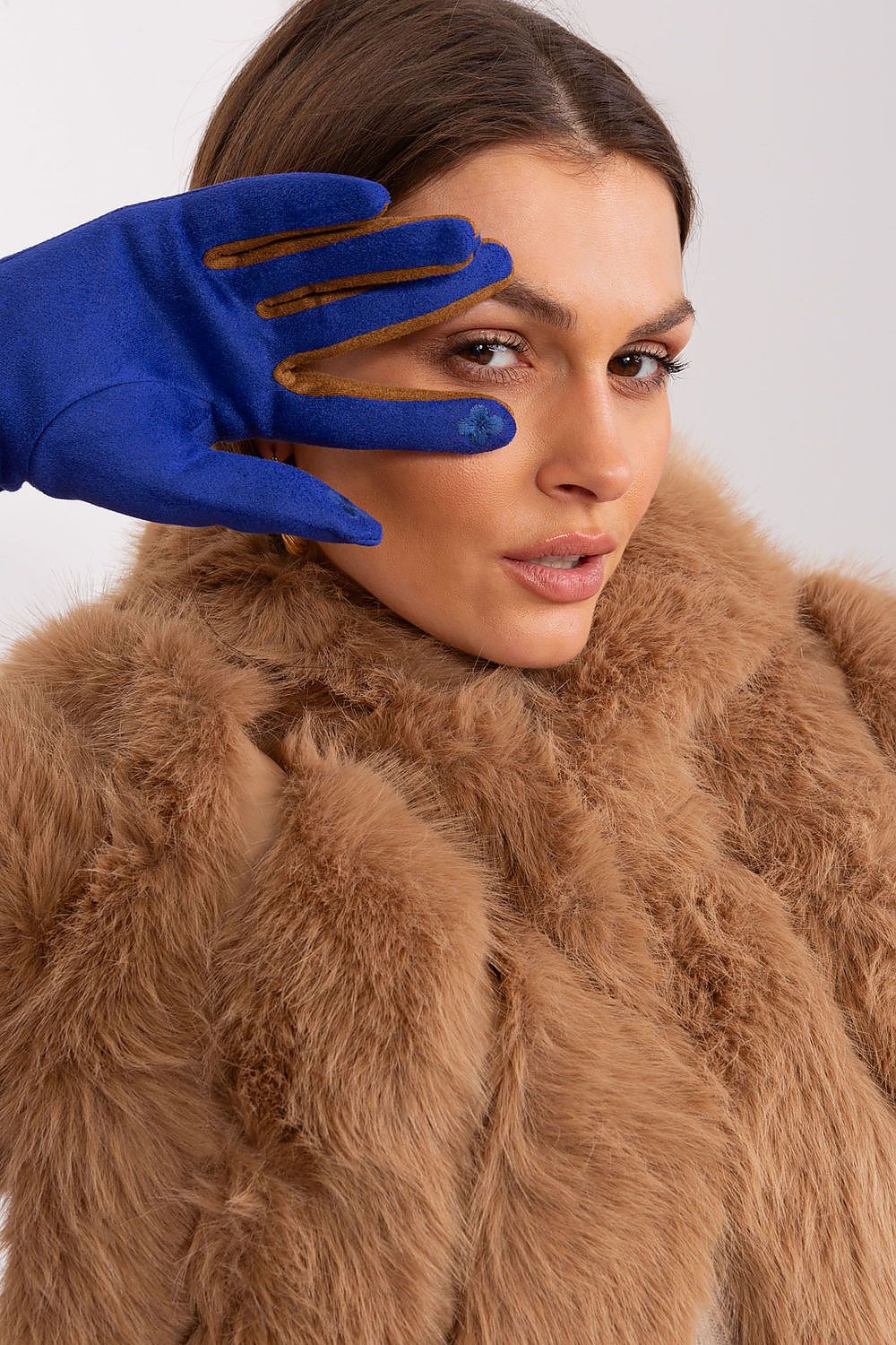 Beautifully crafted touchscreen gloves by AT, adorned with a delicate embroidered flower on thumb and index finger.