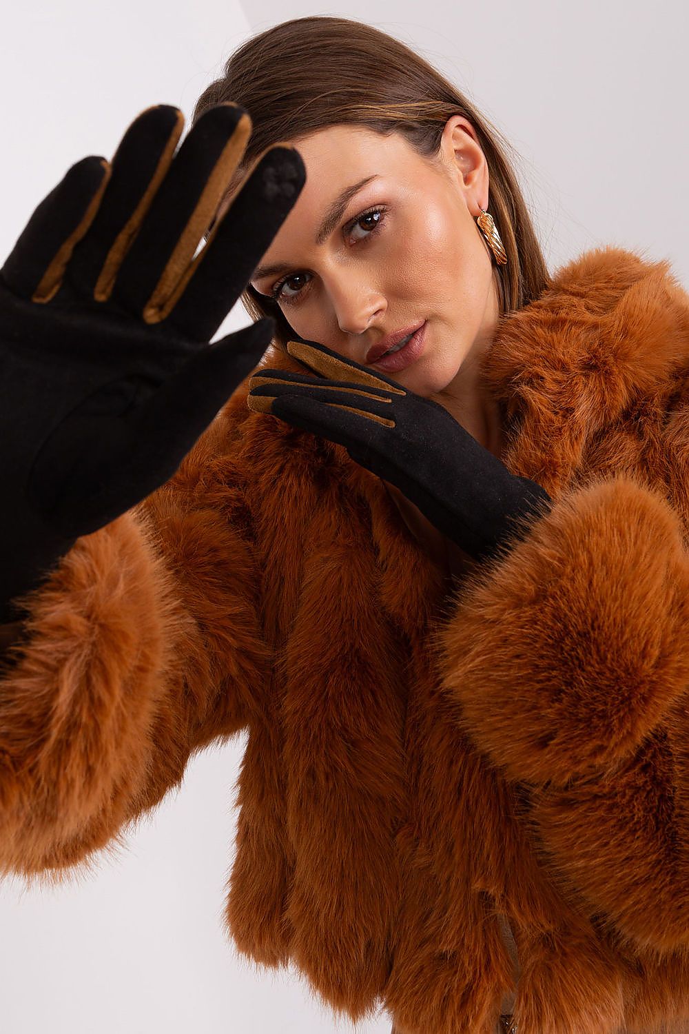 Opulent women's gloves by AT with unique embroidered details and braided straps, combining aesthetics and practicality for touchscreen devices.