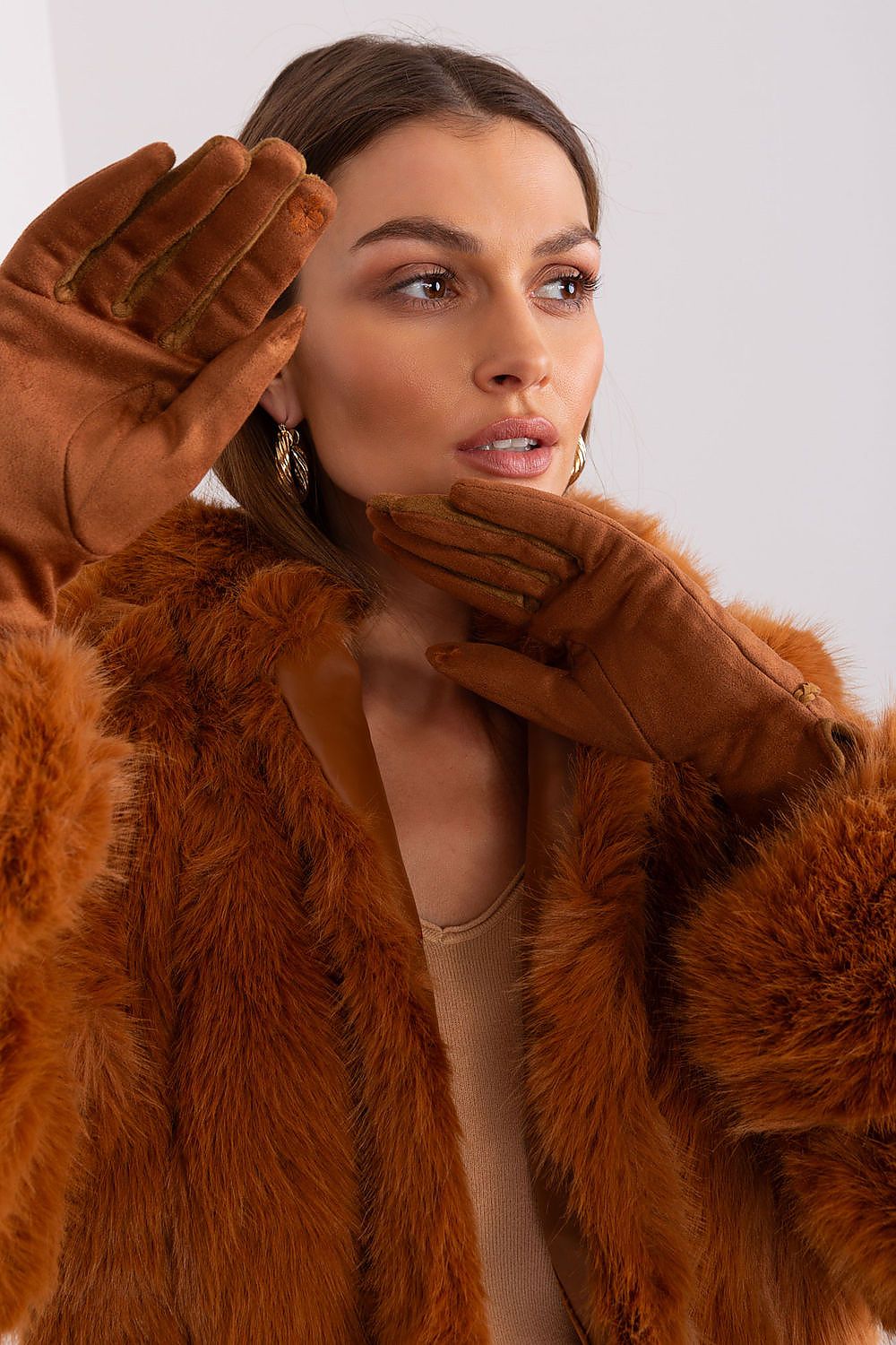 Close-up view of AT's luxurious women's touchscreen gloves, showcasing the intricate braided wrist straps and exquisite floral embroidery.