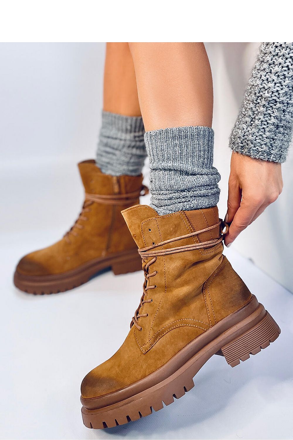 Elegant Inello women's eco-friendly nubuck trapper boots with lace-up detail and side zipper, perfect for a chic autumn outfit.