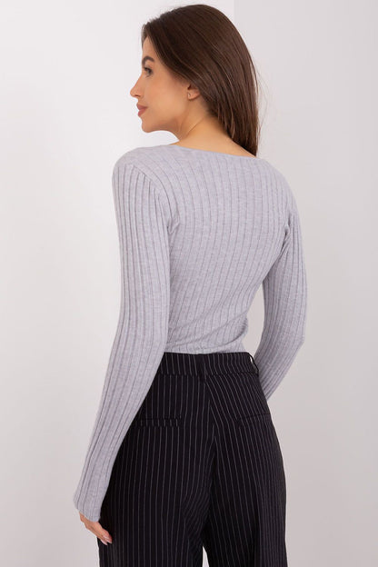 Fashionable and versatile ribbed women's sweater from Factory Price, showcasing a classic V neck and long sleeves, perfect for chic winter outfits.
