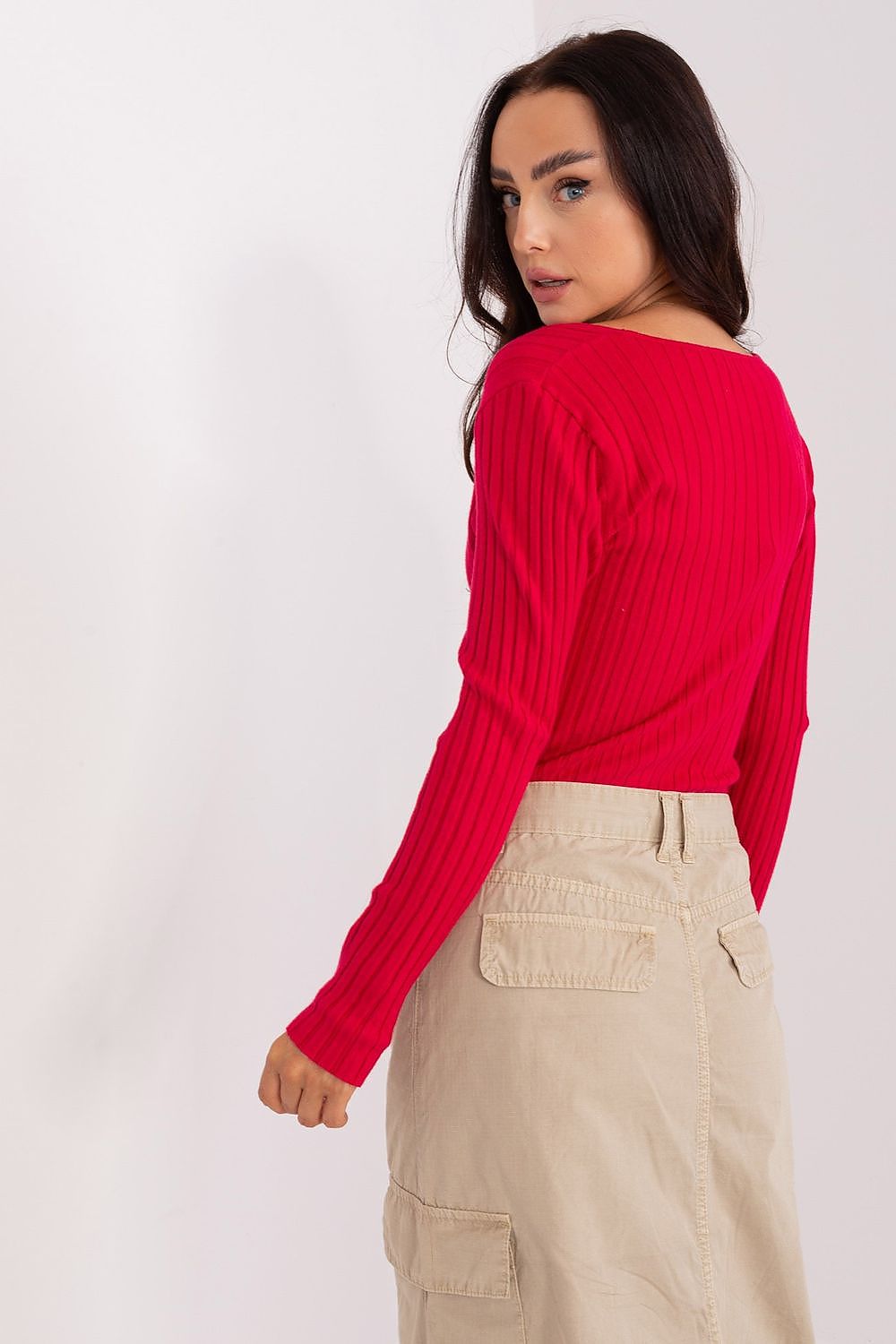 Model wearing a luxury long sleeve viscose women's sweater in a casual setting, showcasing versatility and style, by Factory Price.