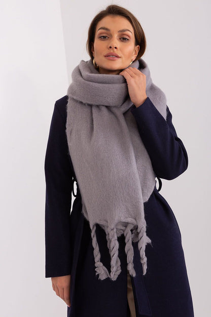 Luxurious 100% polyester long scarf with tassels by AT, perfect for keeping warm in fall and winter.