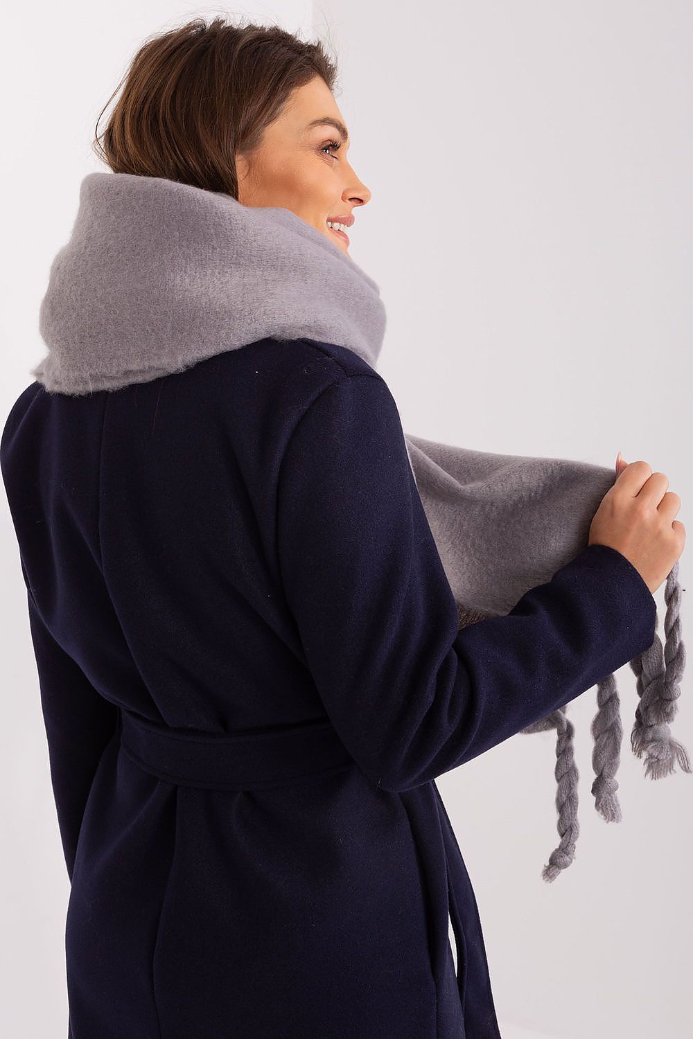 High-quality luxury scarf by AT, showcasing a smooth texture and versatility for different styles in cold weather.