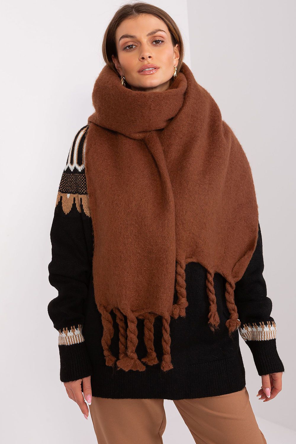 Versatile 100% polyester shawl by AT, designed for warmth and elegance during fall and winter with chic tassels.