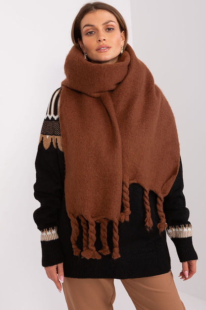 Versatile 100% polyester shawl by AT, designed for warmth and elegance during fall and winter with chic tassels.