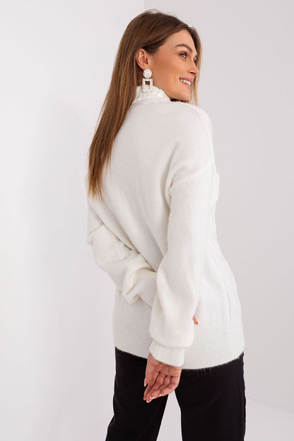 Elegant Variegated Weave Turtleneck Sweater in a contemporary setting by AT, styled with denim for a chic casual look that exudes sophistication.