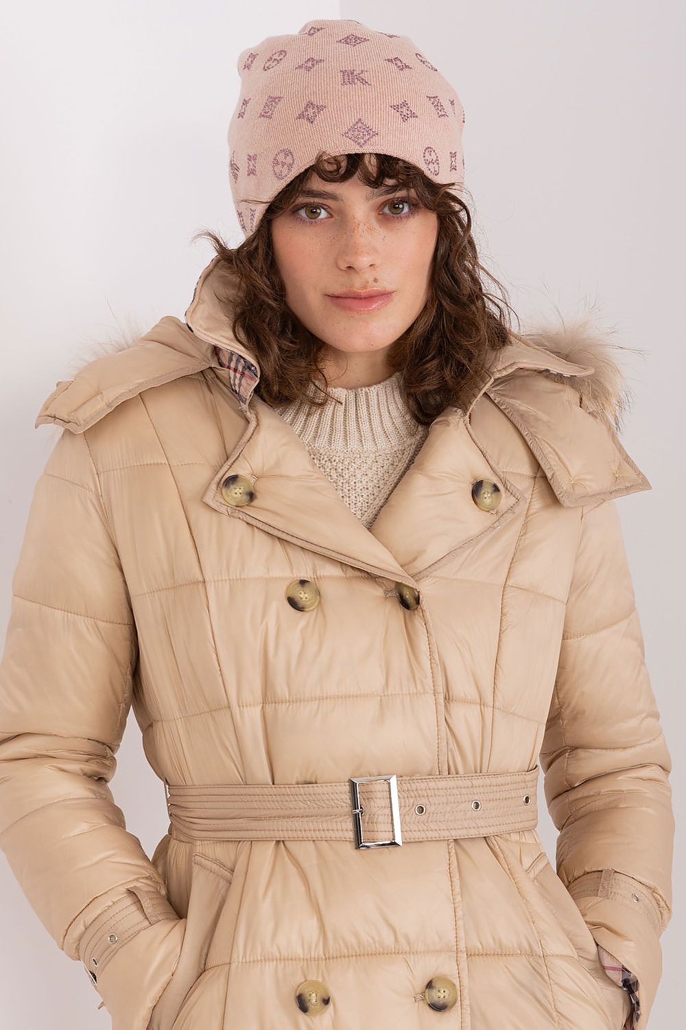 Elegant winter styling featuring the AT Women's Cashmere Blend Beanie Hat, adorned with chic rhinestones.