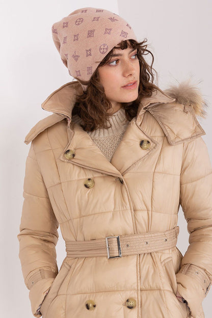 Stylish woman wearing AT luxurious winter beanie hat, blending warmth and elegance with cashmere and rhinestones.