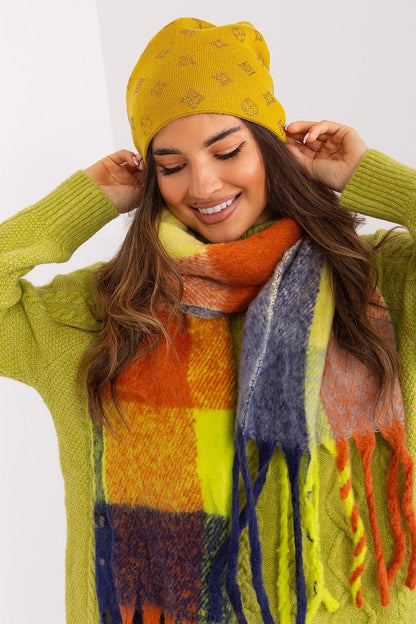 AT women's cashmere blend beanie hat on a decorative background, highlighting its chic rhinestone accents for winter fashion.