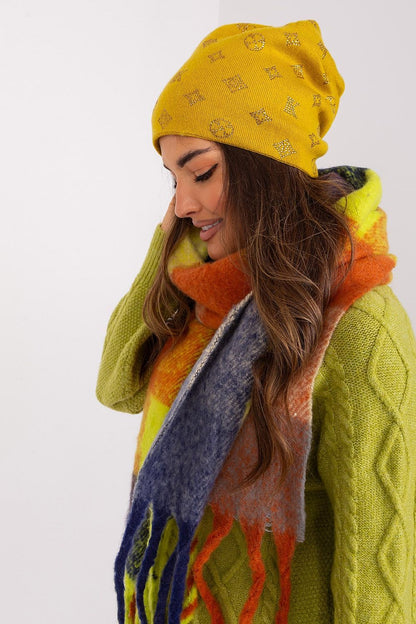 Close-up of AT's women's cashmere blend beanie hat highlighting the soft fabric and sparkling rhinestones, ideal for winter warmth.