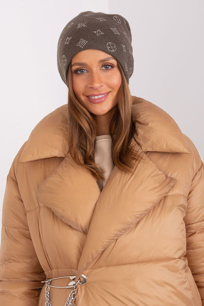 AT's luxurious women's beanie hat made with a cashmere blend, highlighting sparkling rhinestones for a sophisticated winter accessory.