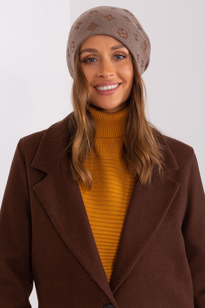 Stylish winter essential by AT, a women's cashmere blend beanie hat with rhinestones, offering both warmth and luxury.