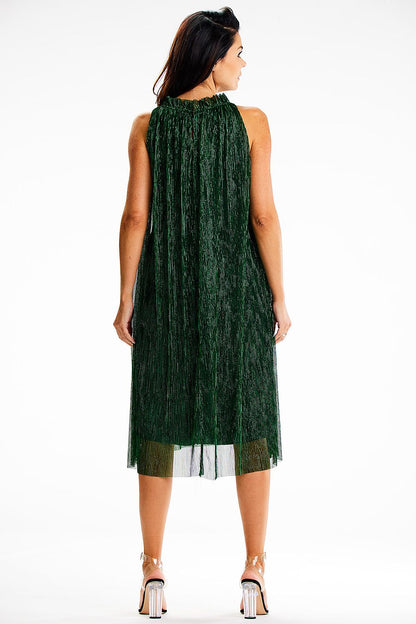 Side view of the chic Awama midi dress, highlighting its flattering silhouette and graceful length.