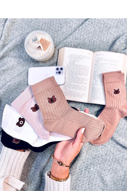 Close-up of Inello's elegant long socks with cute teddy bear accents, made from a plush cotton-blend, perfect for adding charm to your wardrobe.