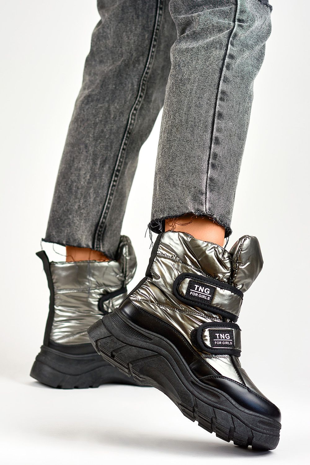 Close-up view of PRIMO's luxurious silver snow boots for women, showcasing the eco fur lining and refined black accents, perfect for cold weather style.