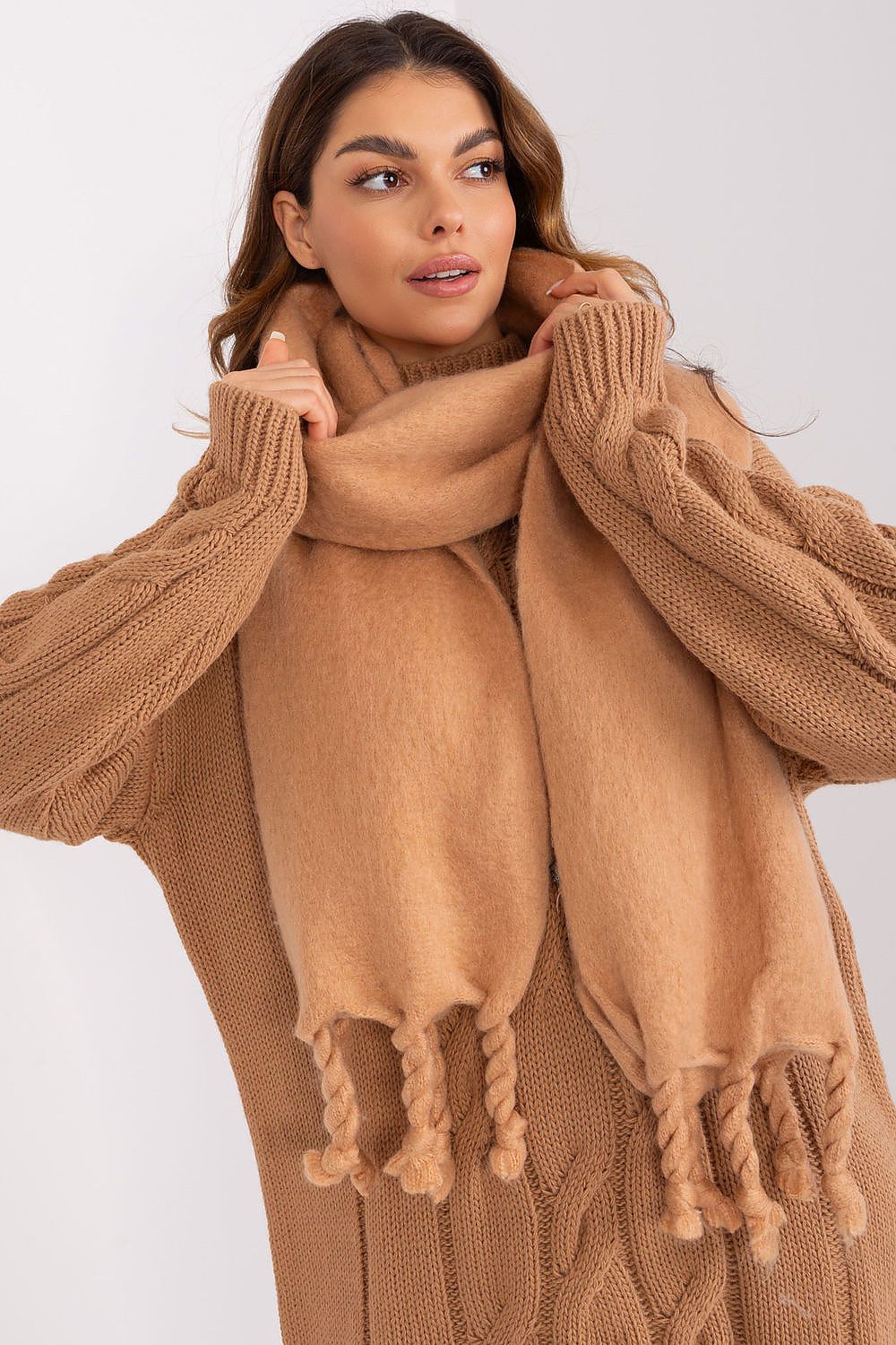 AT long scarf draped elegantly, illustrating multiple ways to wear this luxury accessory for added warmth and style in colder weather.