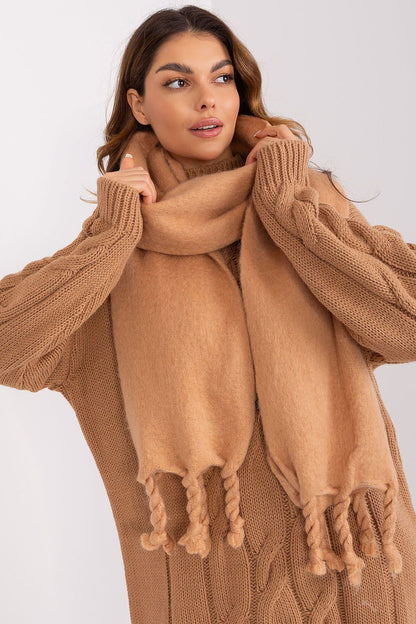 AT long scarf draped elegantly, illustrating multiple ways to wear this luxury accessory for added warmth and style in colder weather.