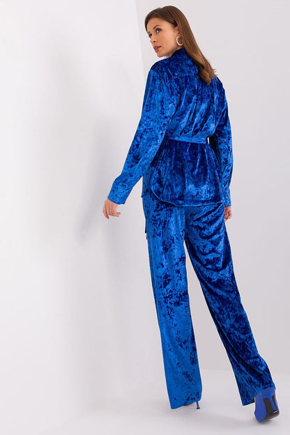 The stylish button-up shirt and wide leg high waist pants from Lakerta's velour set, designed for fashionable comfort.