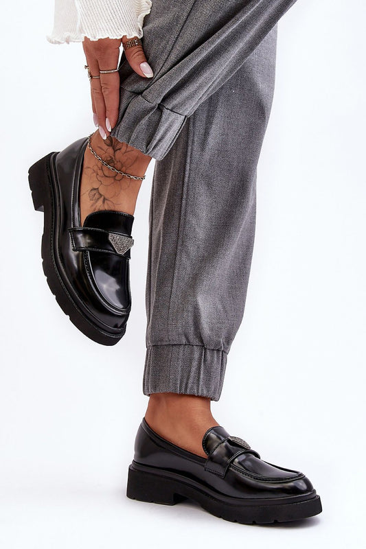 Luxury women's eco leather half shoes with decorative strap, styled with grey trousers, showcasing comfort and elegance by Step in Style.