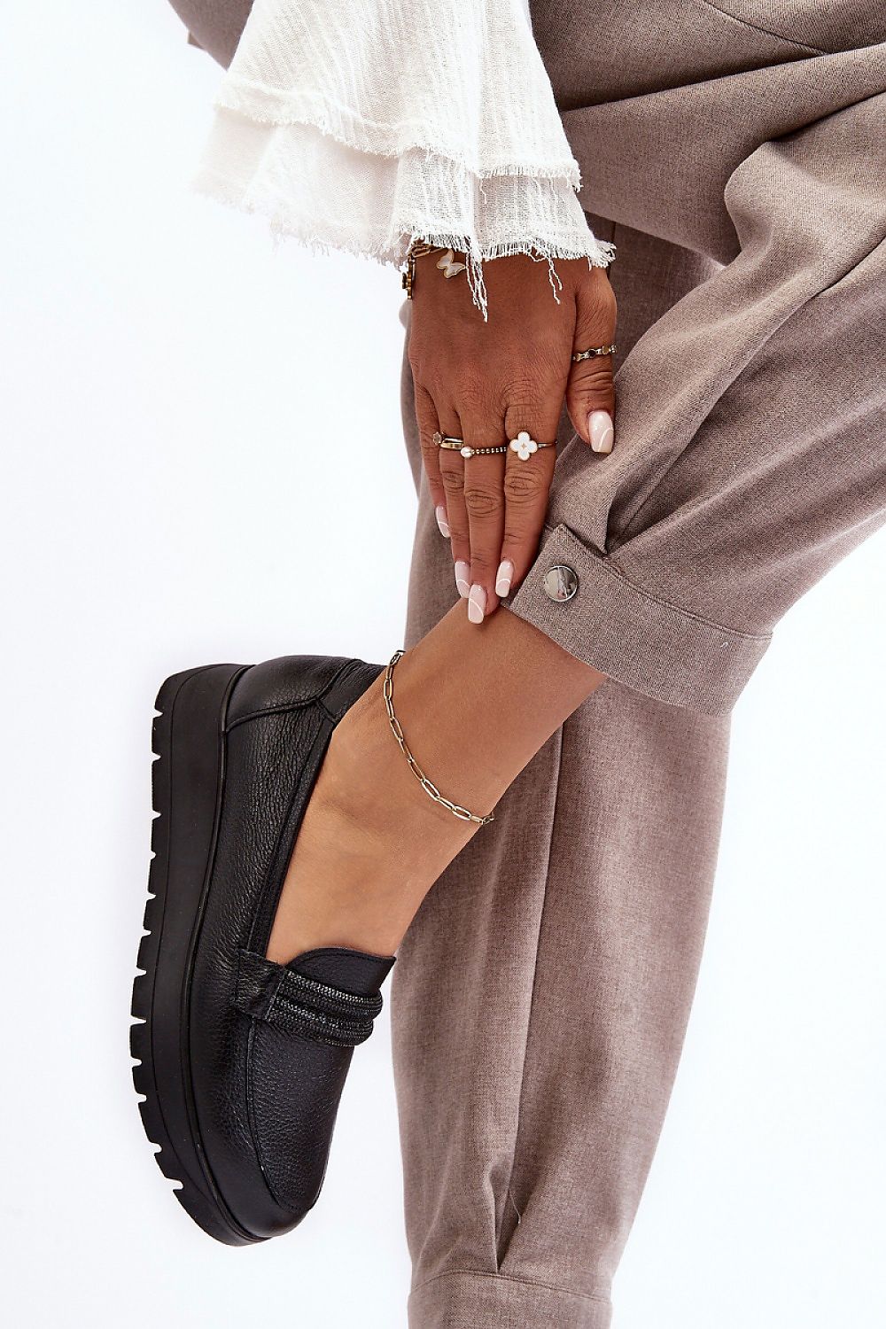 Elegant women's slip-on half shoes in natural leather by Step in Style, featuring a comfortable platform design with a rounded nose for a chic and luxurious look.