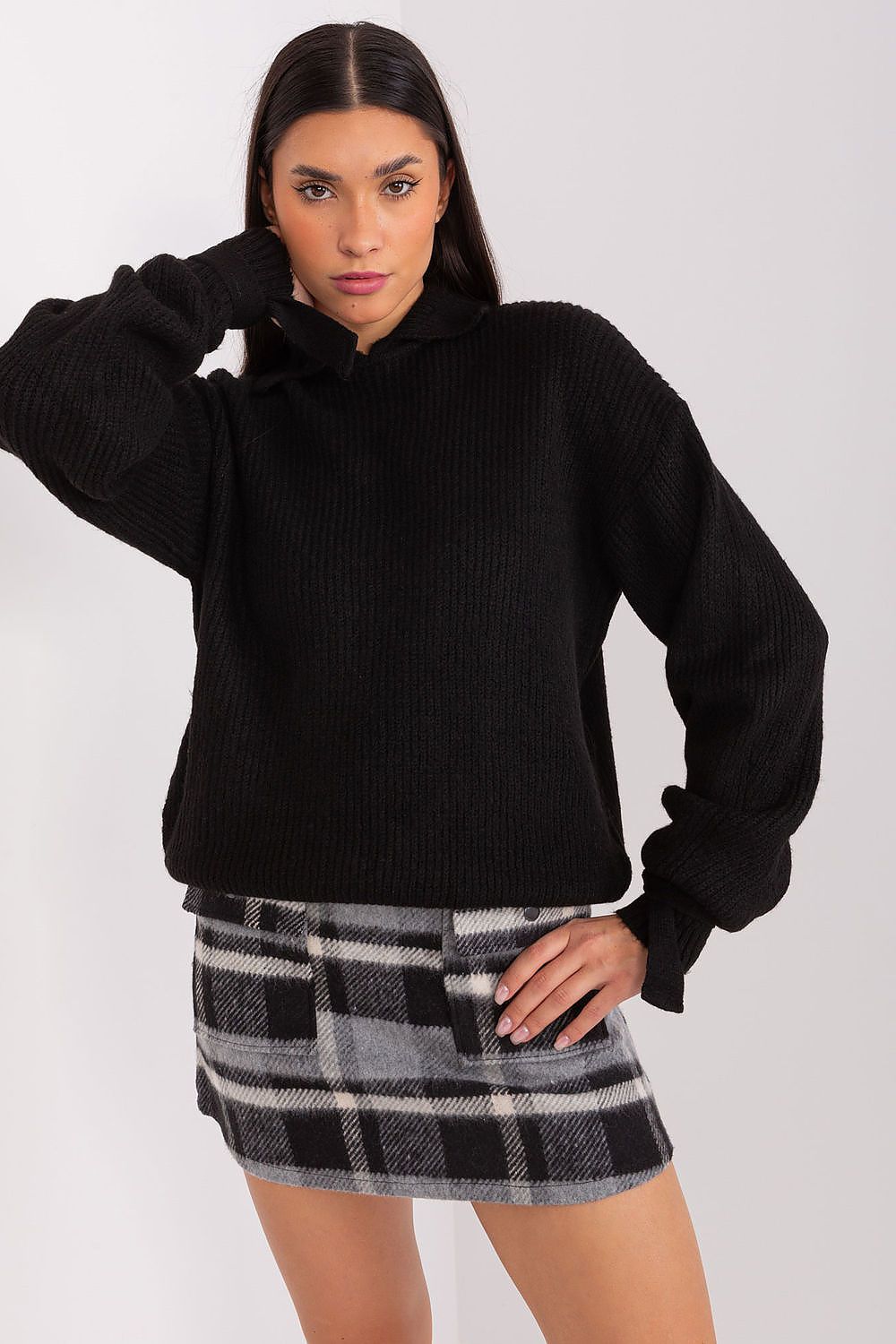 Elegant Badu Jumper featuring a stylish turtleneck design with decorative cuffs, ideal for versatile fashion.
