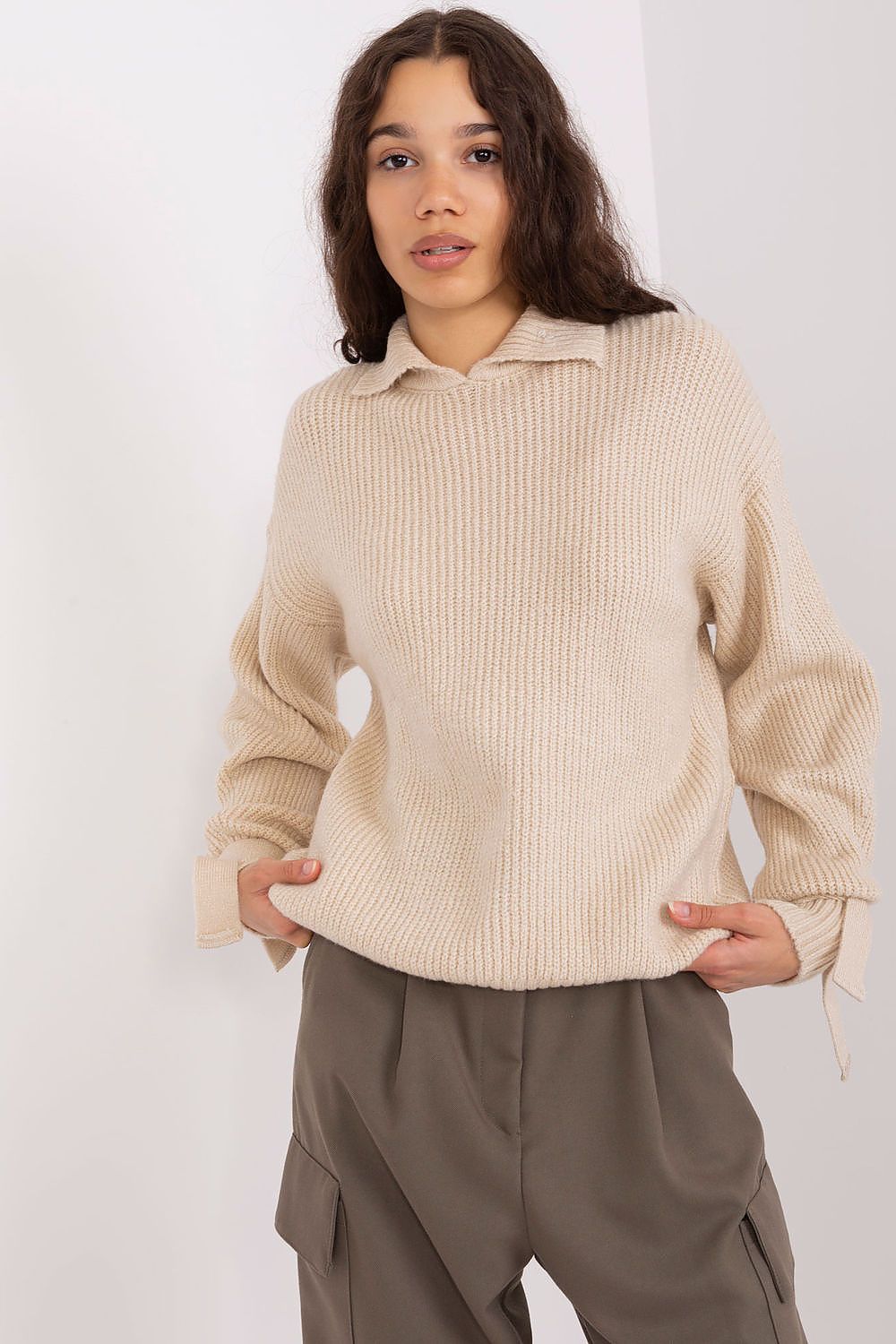 The Badu Jumper worn casually with jeans, illustrating its versatility for everyday elegance.