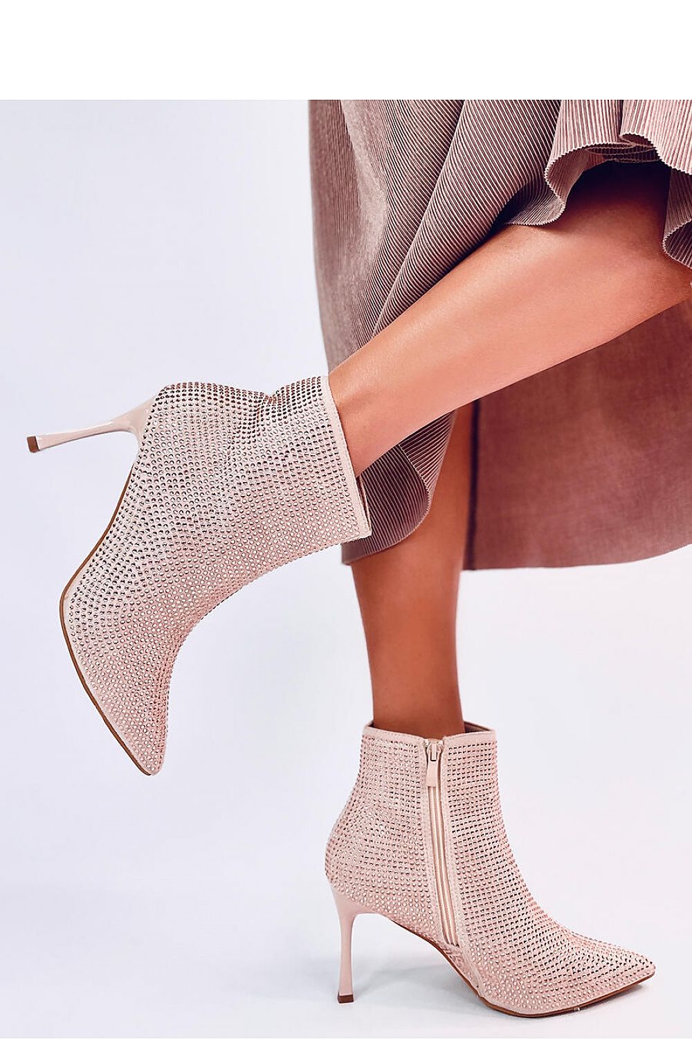 Close-up of luxury women's stiletto heel boots with sparkling crystals, featuring eco-suede by Inello, perfect for high-fashion looks.