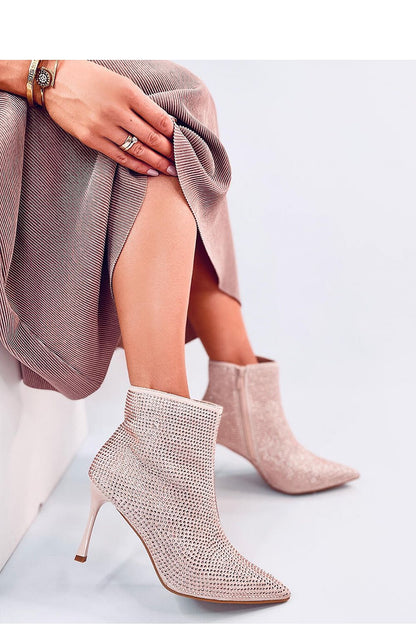 Dramatic view of Inello luxury women's stiletto heel boots with 9 cm heels and zipper closure, adorned with eye-catching crystals.